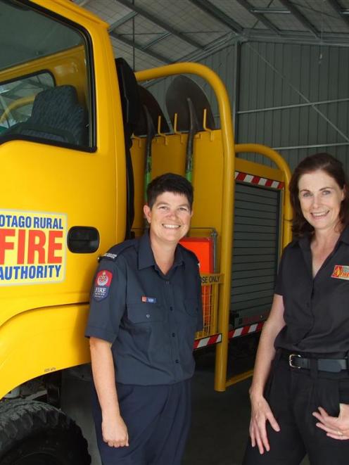 Volunteer fire- fighter Lisa Davis (left), with Otago Rural Fire Authority principal rural fire...