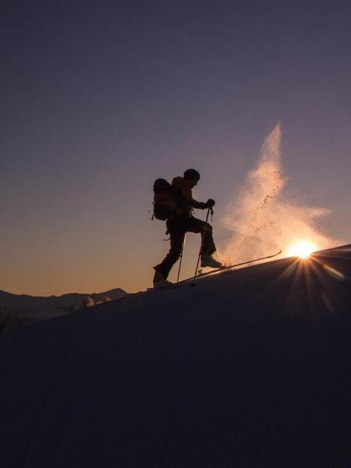 A ski tourer on Coronet Peak. Photo by Guillaume Charton.