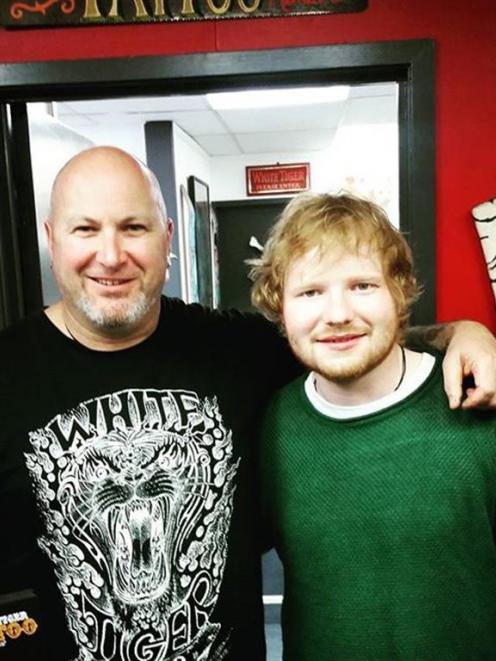 Tattoo artist Scott Mcfarlane (left) with singer Ed Sheeran in Queenstown. PHOTO: SUPPLIED