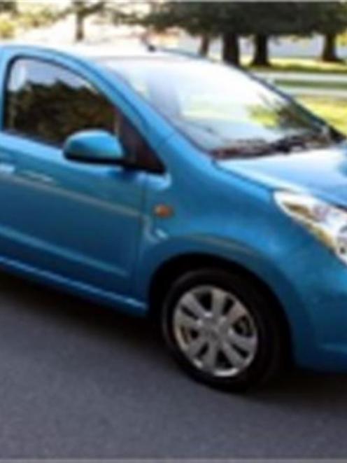 Dunedin police say they are looking for a light blue four-door hatchback car, similar to this...