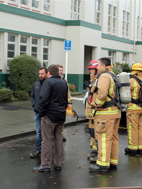 Southern Institute of Technology facilities manager Neil Smith (back to camera) talks to...