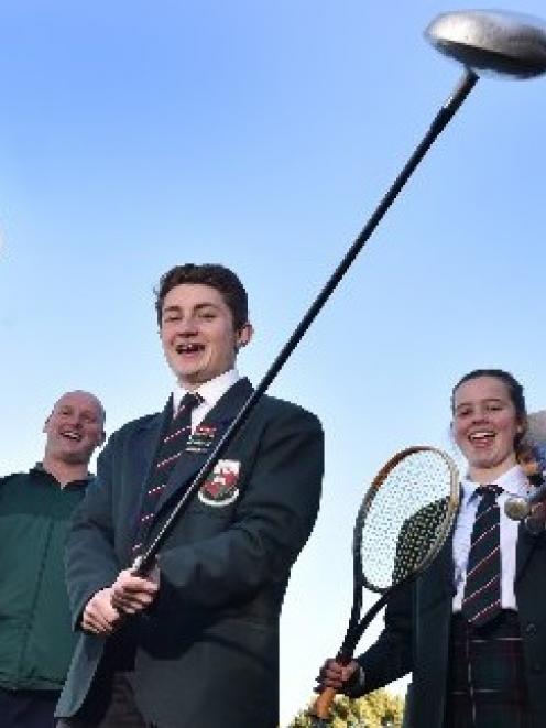 Head of sport Jeremy Scott and year 13 pupils Jesse Irvine (left) and Jess Chisholm (both 17)...