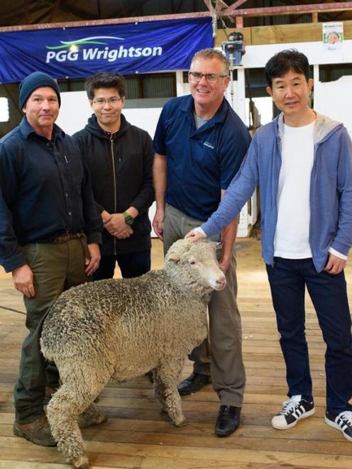 Inspecting  an animal at Closeburn Station are station owner Tony Clarke (left), Nagao Shoji vice...