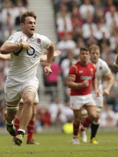 Jack Clifford runs in to score England's fourth try. Photo: Reuters