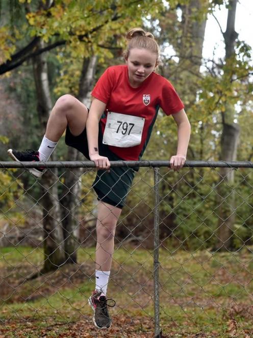 Kaikorai Valley High School pupil Daneka McHaffie (13) negotiates a fence during the Otago...