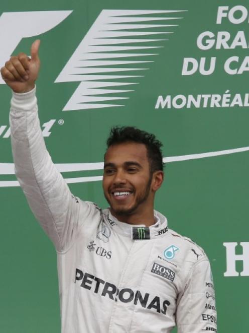 Lewis Hamilton celebrates after winning the Canadian Grand Prix. Photo: Reuters