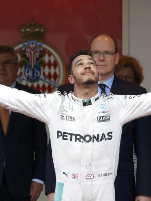 Lewis Hamilton celebrates winning the Grand Prix. Photo: Reuters