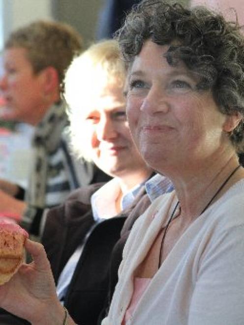 Louise McDougall enjoys a cupcake at the Pink Ribbon Breakfast yesterday morning. PHOTO: HAMISH...