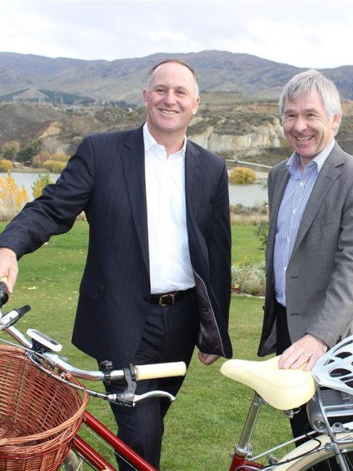 Prime Minister John Key and Central Lakes Trust chief executive Paul Allison celebrate a proposed...