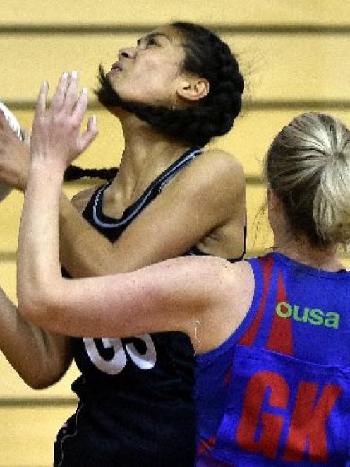 Southern Tui goal shoot Tenisha Fifita (left) struggles to shake University Albion B goal keep...