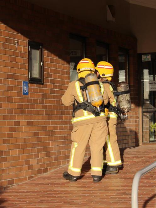 Two members of the Balclutha Volunteer Fire Brigade investigate a false alarm at the Clutha...