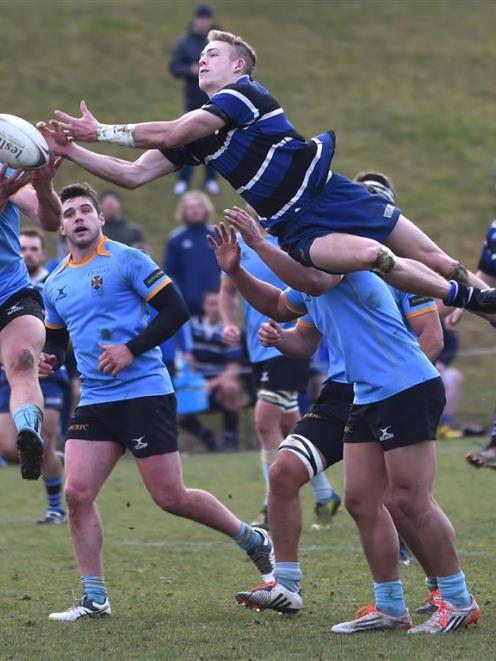A player Harry Peeters (left) and Kaikorai outside back Matt Jones compete for the ball during a...