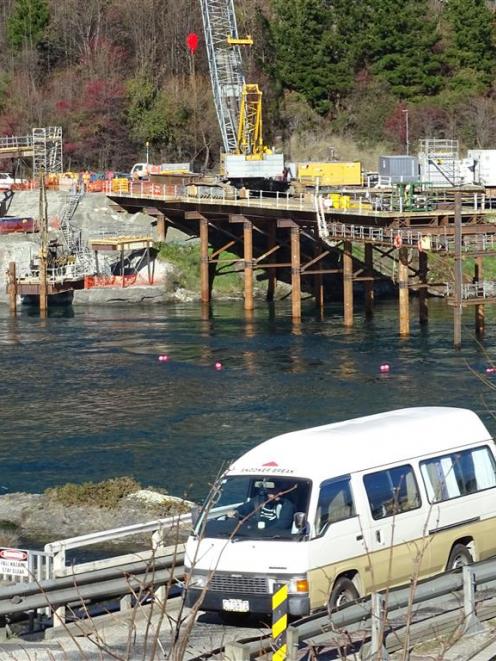 A temporary platform juts into the Kawarau River from its southern bank at the site of the...