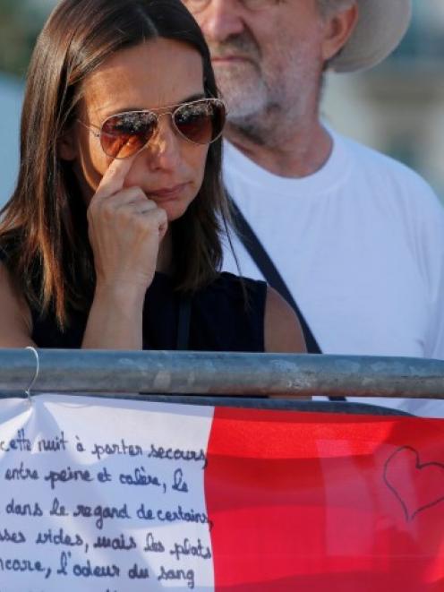 A woman grieves at a tribute to victims of the Nice attack. Photo Reuters