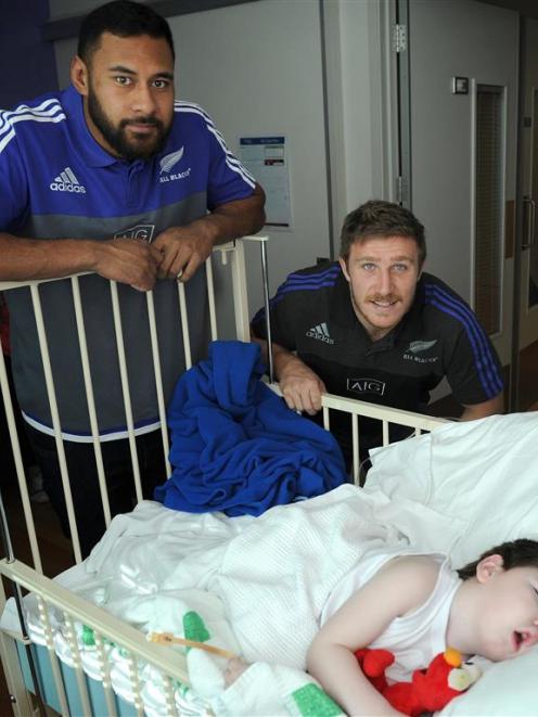 All Blacks Patrick Tuipulotu (left) and Nathan Harris visit Lukas Bates  in the Dunedin Hospital...