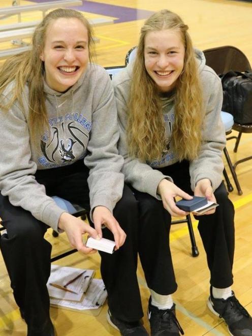Brittany (left) and Zoe Richards  courtside  in the United States earlier this year. Photo by...