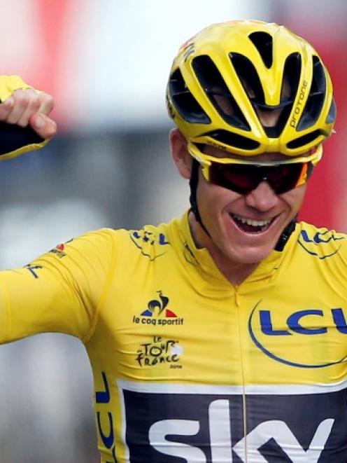 Chris Froome celebrates on the finish line of the final stage. Photo: Reuters