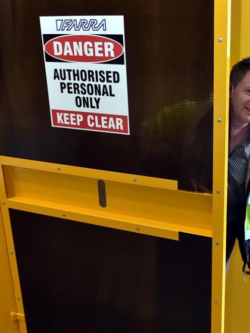 Farra Engineering manager Mark Stuart with a lockable lift hoarding cover. Photo by Gregor...