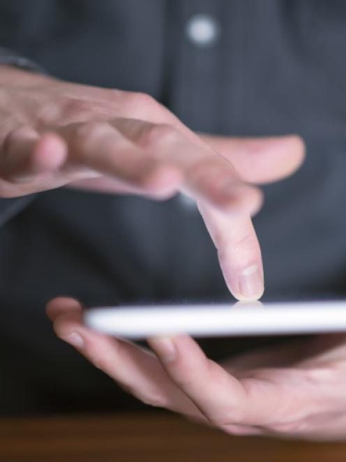 The Government wants people to use their smartphones and  tablets. Photo: Getty Images
