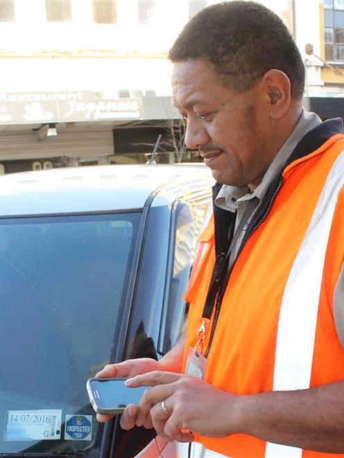 Invercargill City Council compliance team leader Kerry Kawe checks out a vehicle’s expired...