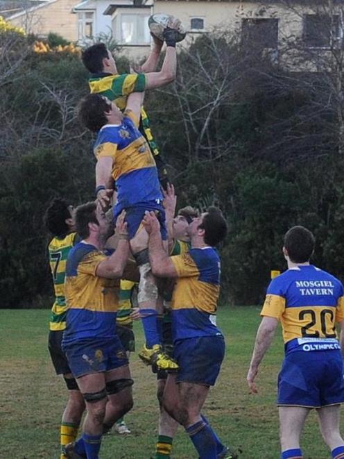 Matt McCutcheon (Green Island) beats Brodie Hume (Taieri) to the lineout ball at Miller Park on...