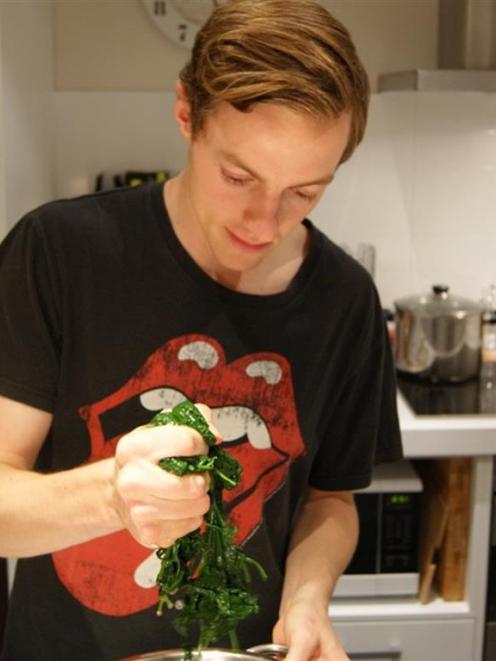 Otago medical student Alby Hailes (22) prepares palak paneer for his flatmates. Photos supplied.
