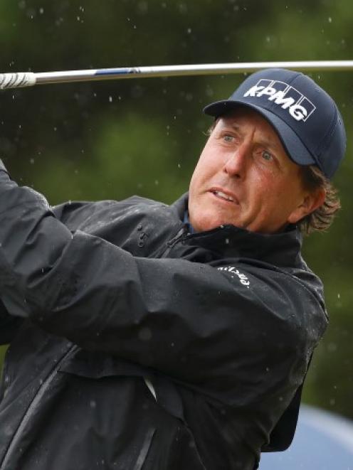 Phil Mickelson watches his tee shot on the 12th hole during the second round. Photo Reuters