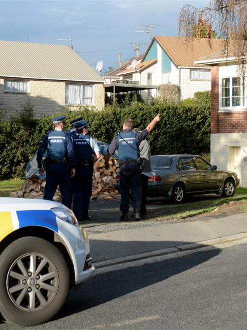 Police speak to two people after an apparent home invasion in Green Island left a man with...