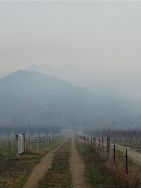 Rubbish being burnt on orchards adds to the smoky haze over Clyde. Photo by Mark Price.