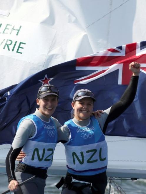 Jo Aleh and Polly Powrie celebrate after finishing their Olympics campaign to claim the silver...