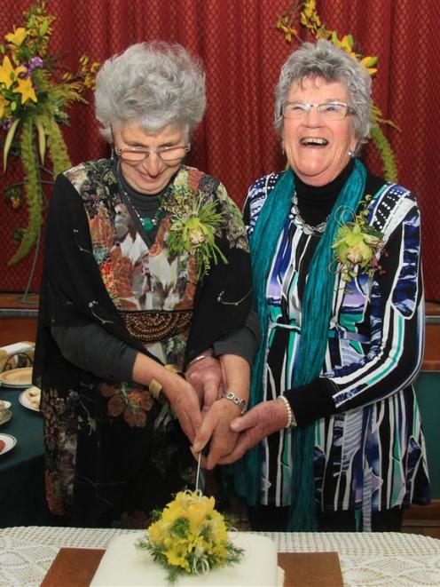 Cutting the cake to celebrate 50 years of floral designing in North Otago are North Otago Floral...