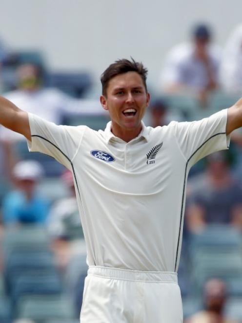 Trent Boult celebrates after taking the wicket of Adam Voges at the WACA. Photo: Reuters