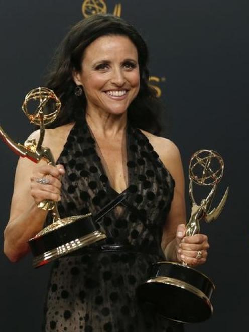 Julia Louis-Dreyfus poses with her awards for Outstanding Comedy Series and Outstanding Lead...