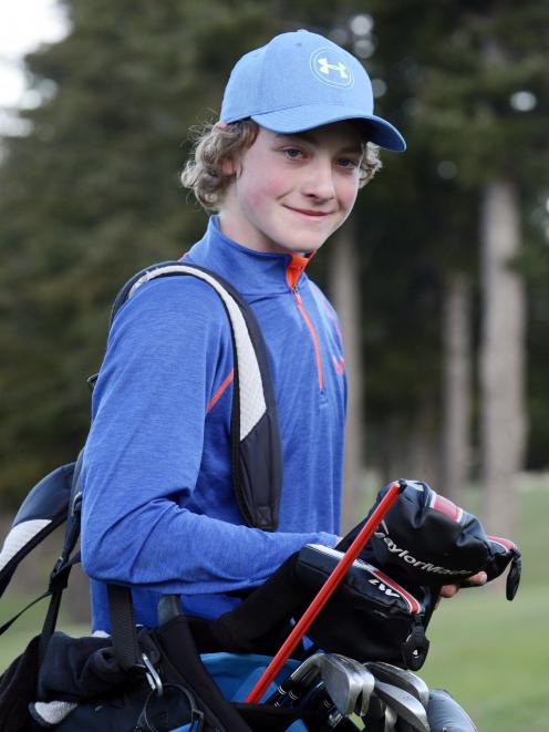 Golfer Joseph Hancock carries the tools of his trade during a practice round at the Otago Golf Club earlier this week. Photo by Gerard O'Brien.