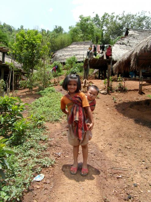 Akha tribe siblings Inland from Mae Suai, in Thailand.