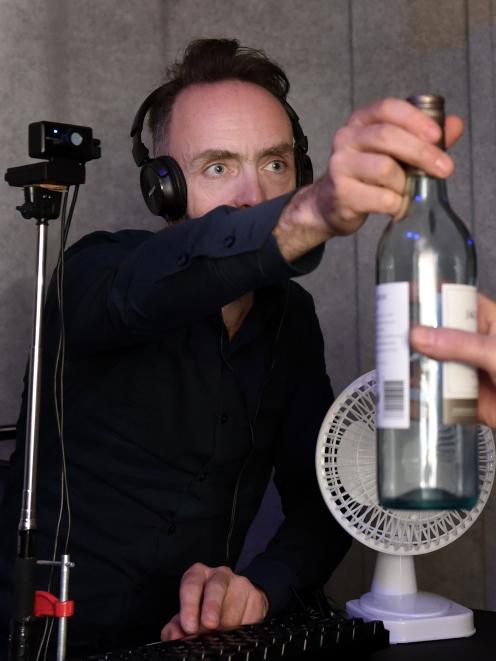 British transmedia artist Simon Wilkinson ‘‘hands a bottle’’ to a virtual audience member in The...