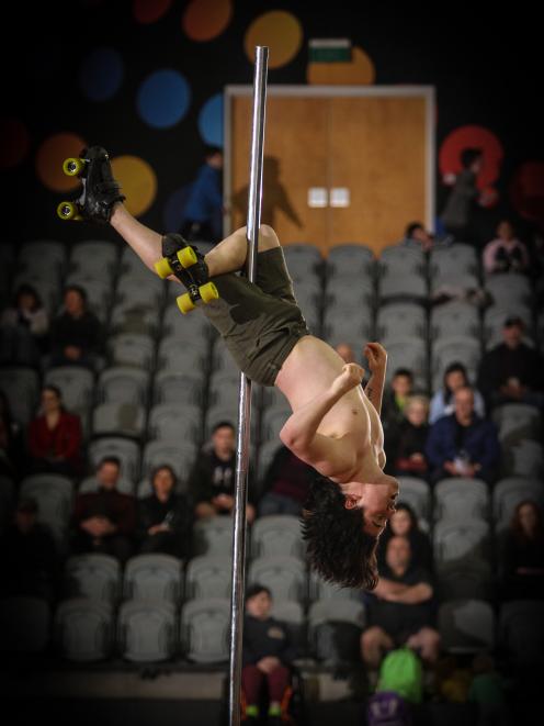 Steve Ting gets upside down during a pole dance. PHOTO: ANDREW MACKAY
