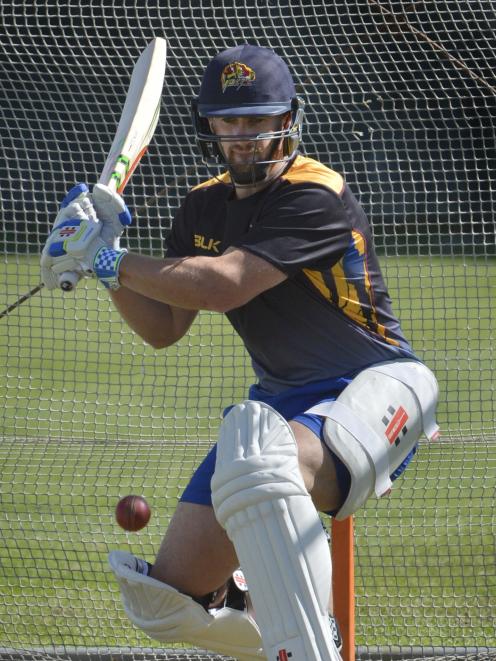 Otago top-order batsman Neil Broom looks to sweep the ball during a training session at...
