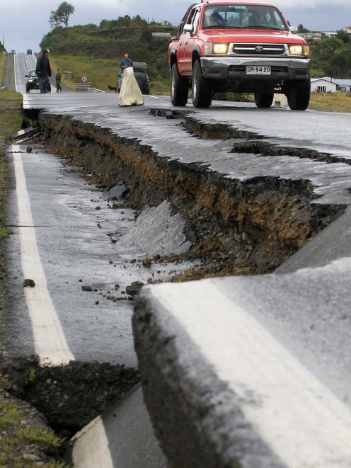 A quake-damaged road at Chadmo, on Chiloe island. Photo: Reuters