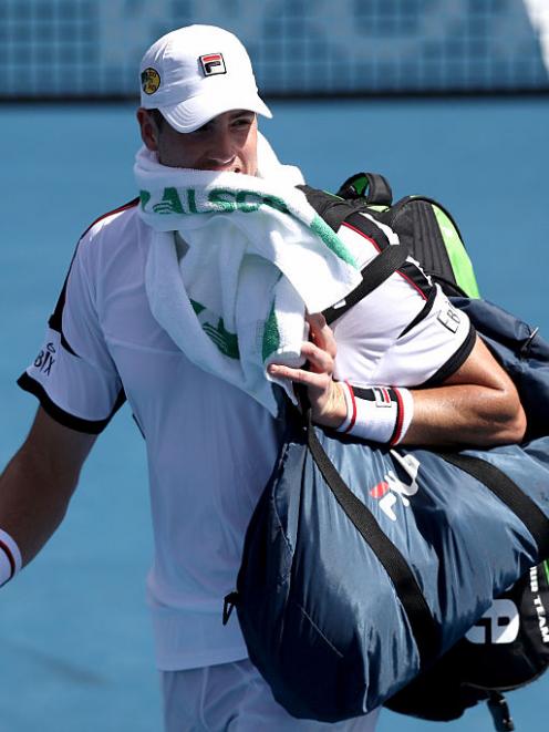 John Isner leaves the court following his loss to Steve Johnson. Photo Getty