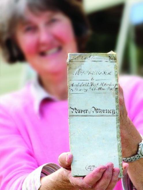 Edith Cromie, of Waihao Downs, displays the 153-year-old declaration of title to the brig Grecian...