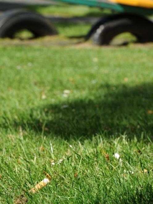 A cigarette butt in the playground in Mornington, Dunedin. Photo by Craig Baxter.
