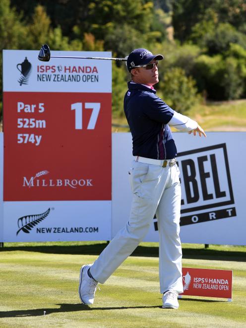 Tournament leader Brad Kennedy, of Australia, tees off on the 17th hole at Millbrook during the...