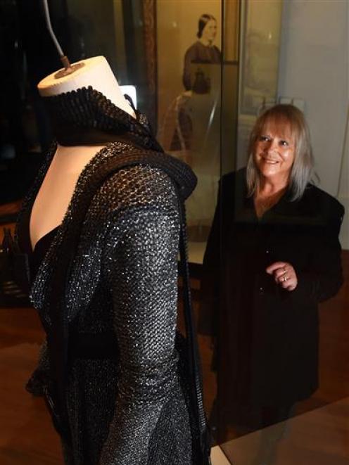 Dunedin fashion designer Donna Tulloch, of Mild-Red, with a garment from her Black Knight...