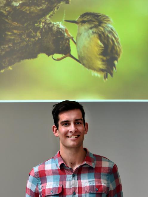 Douglas Thorne and his photo Rifleman perched won the top prize at the 2017 Otago Wildlife Photography Competition at Otago Museum on Saturday. Photo by Peter McIntosh.