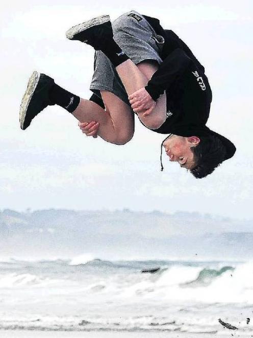 Cody Veenvliet practises parkour on Brighton beach before heading to the first New Zealand...