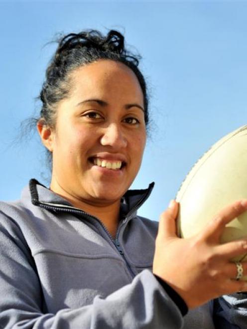Gemma Tuhega celebrates 150 premier games for Pirates. Photo by Linda Robertson.