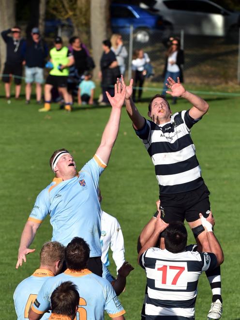 Southern lock Josh Clark competes for the ball with University lock Jack Sherratt during a...