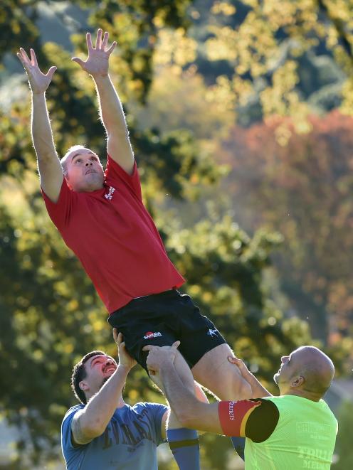 Scott Allison takes lineout ball with the assistance of  Hua Tamariki (left) and Lyal Bayliss...