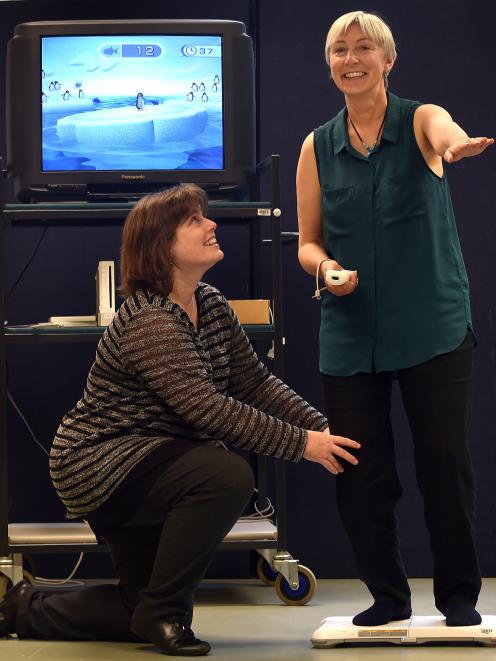 School of Physiotherapy lecturer Dr Cathy Chapple (left) shows Jane Terry how to use a Wii Fit console. Photo by Peter McIntosh.